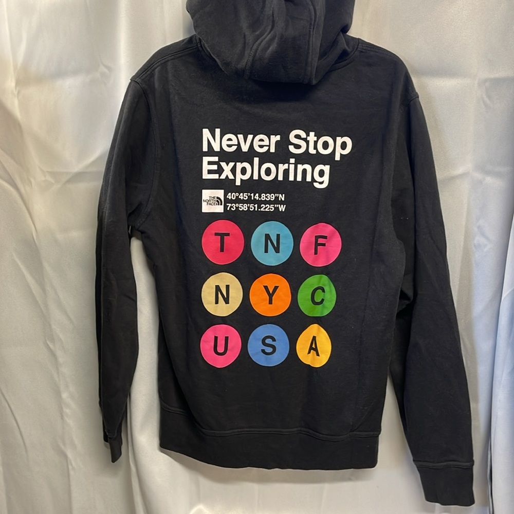 North face Never Stop Exploring Hooded Sweatshirt. NYC subway symbols.